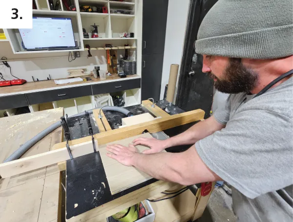 Machine the running slots on shelf edges with wing cutter on router/shaper table. Use stop blocks on fence to keep slots blind within shelf edges